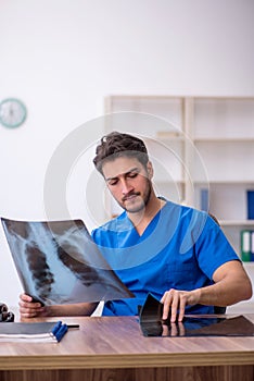 Young male doctor radiologist working in the clinic