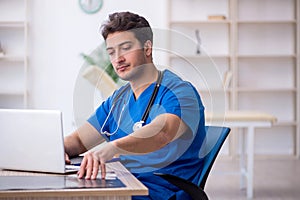 Young male doctor radiologist working in the clinic