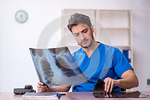 Young male doctor radiologist working in the clinic