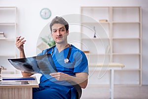 Young male doctor radiologist working in the clinic