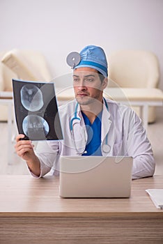 Young male doctor radiologist working in the clinic