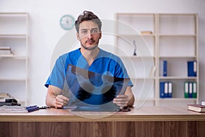 Young male doctor radiologist working in the clinic