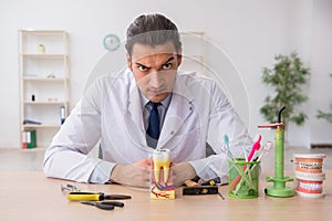 Young male doctor stomatologist working in the clinic