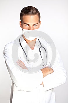 Young male doctor with surgeon mask photo