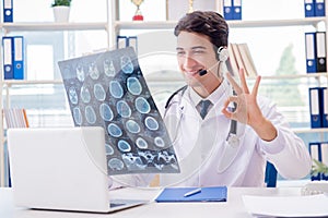 The young male doctor in telehealth concept