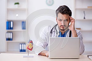 Young male doctor in telemedicine concept