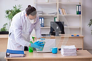 Young male doctor virologist in the office