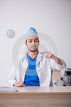 Young male doctor working in the clinic