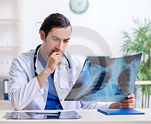 Young male doctor working in the clinic