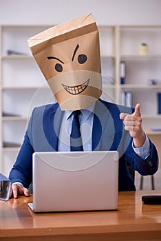 Young male employee with box instead of his head