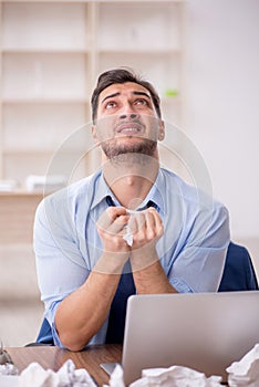 Young male employee in brainstorming concept