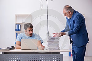 Young male employee feeling bad at workplace