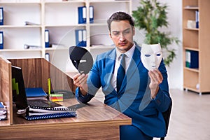 Young male employee wearing mask in the office