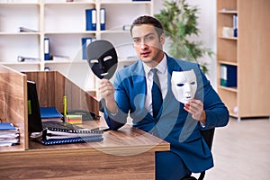 Young male employee wearing mask in the office