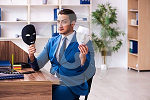 Young male employee wearing mask in the office