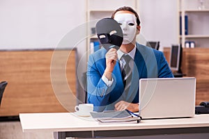 Young male employee wearing masks in the office