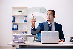 Young male employee working in the office