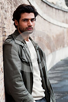 Young male fashion street on wall