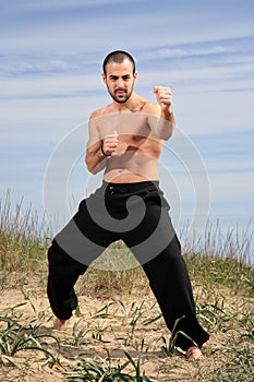 Young male fighter exercise outdoor