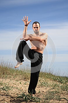 Young male fighter exercise outdoor