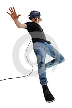 Young male in in the fighting position on white background. Man using the virtual reality simulator