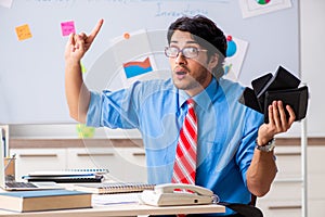 The young male financial manager working in the office