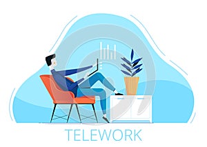 A young male freelancer sits in a chair and works remotely from home. The concept of telework during quarantine and photo