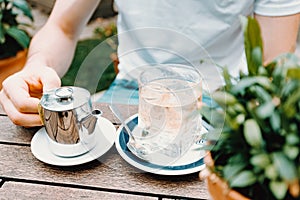 Young male getting ready to prepare a tea in a modern bar