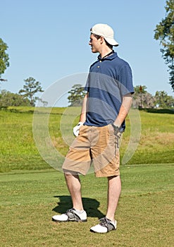 Young Male Golfer Looking over Fairway