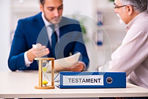 Young male lawyer and old man in testament and time management c