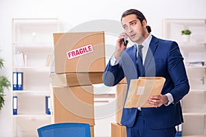 Young male logistics specialist working in the office