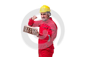 Young male mason with brick isolated on white