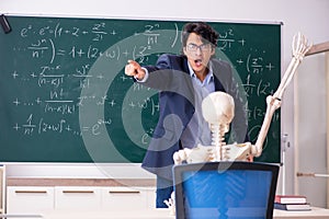 The young male math teacher and student skeleton