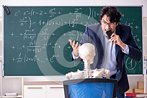 The young male math teacher and student skeleton