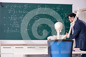 The young male math teacher and student skeleton