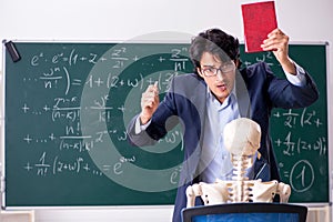 The young male math teacher and student skeleton