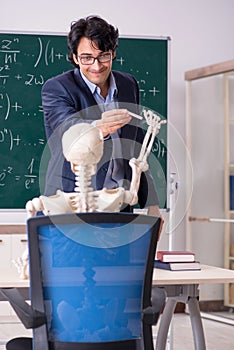 The young male math teacher and student skeleton