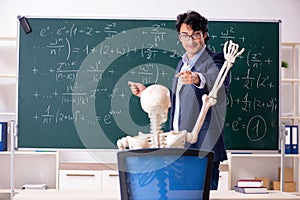 The young male math teacher and student skeleton