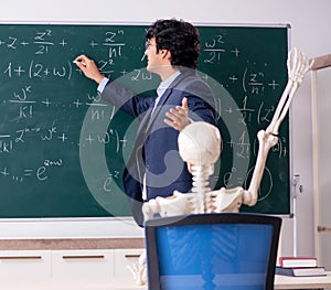 Young male math teacher and student skeleton