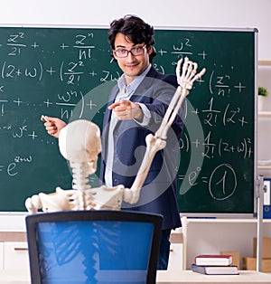 Young male math teacher and student skeleton