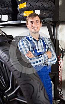 Young male mechanic working in auto repair shop