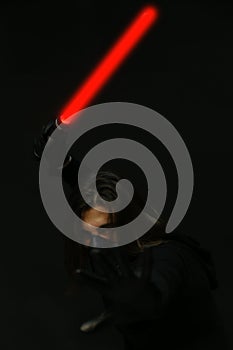 Young male model with mask posing in studio. Fantasy, Halloween, Sci-Fi concept.