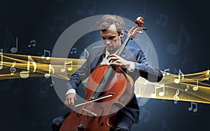 Musician playing on cello with notes around photo
