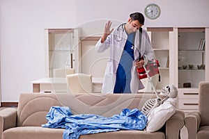 Young male paramedic visiting skeleton patient