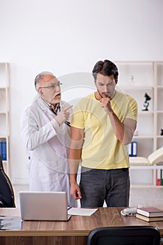 Young male patient visiting old male doctor