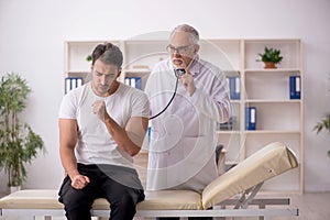 Young male patient visiting old male doctor