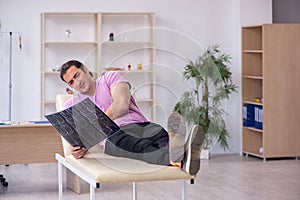 Young male patient waiting for doctor radiologist