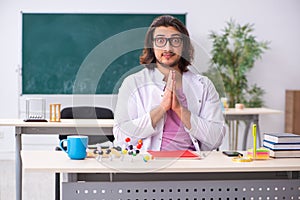 Young male physicist in the classroom