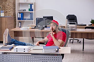 Young male pizza guy in industrial espionage concept