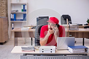 Young male pizza guy in industrial espionage concept